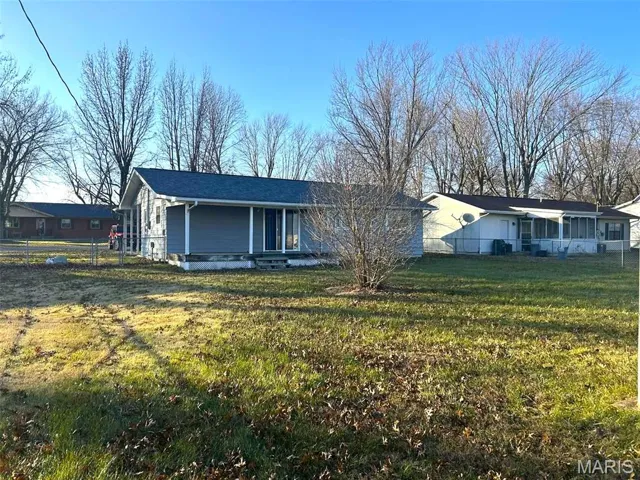 Ranch-style home featuring a porch