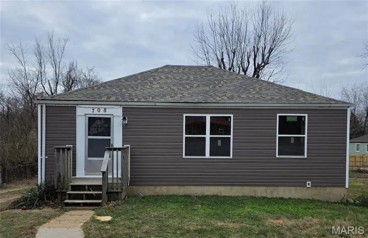 View of front facade featuring a shingled roof