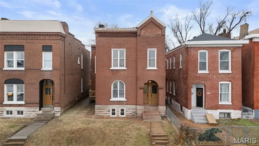 View of front of house featuring brick siding and entry steps