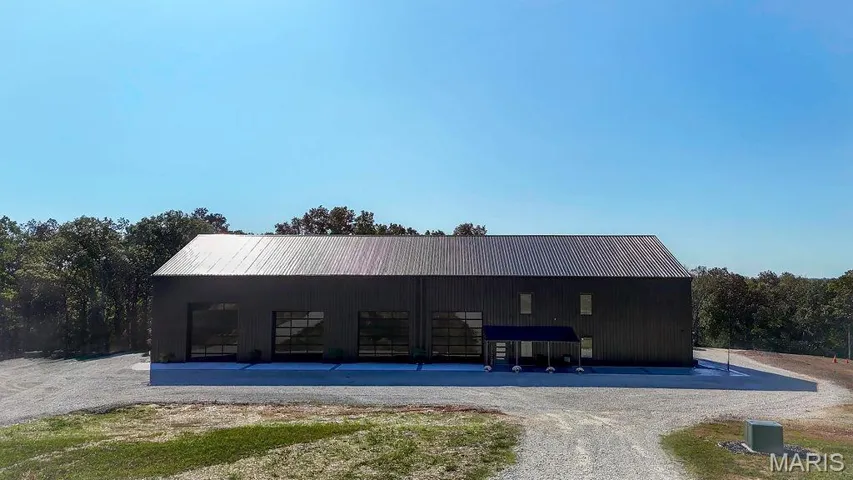 View of property with a pole building