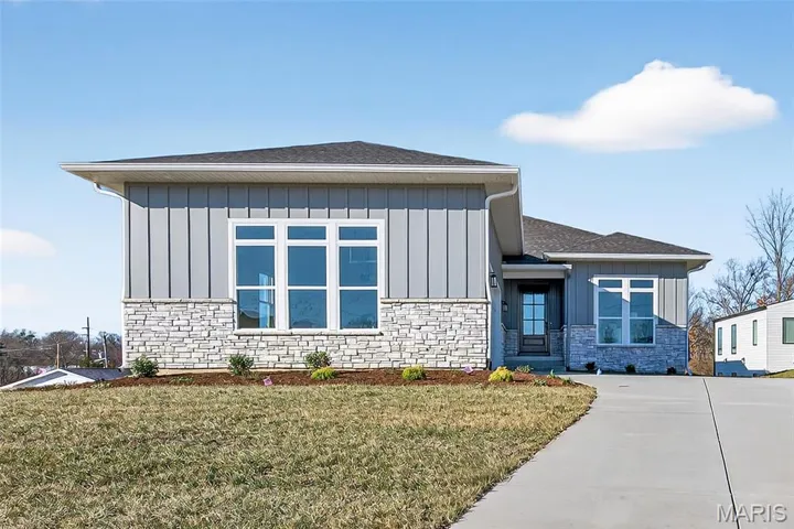 Front Elevation with Stone, Vertical Fiber Cement Siding and Side Entry Garage