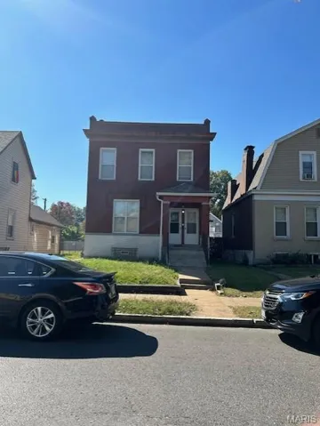 View of front of property with brick siding
