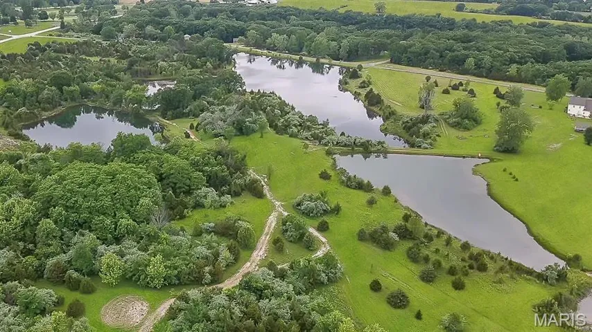 Gorgeous property already subdivided into 8 amazing 3+ acre lots approved by the city/county with utilities. Or build your own private oasis on this 35+ homesite with multiple private lakes!