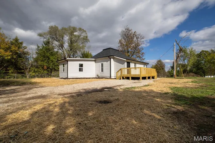 Back of property featuring a deck