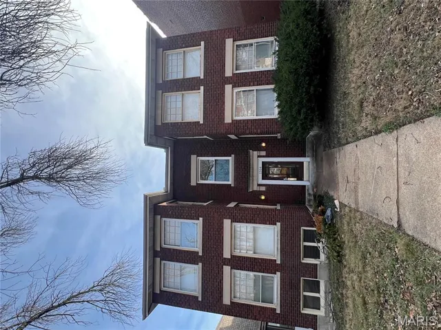 View of front of house with brick siding