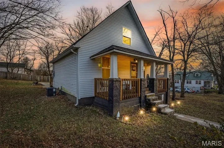 View of front of house with covered porch