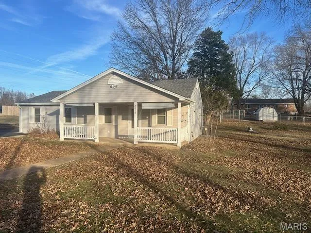 Bungalow featuring a porch
