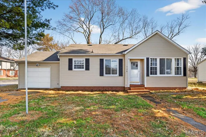 Ranch-style home with a garage, a shingled roof, and entry steps