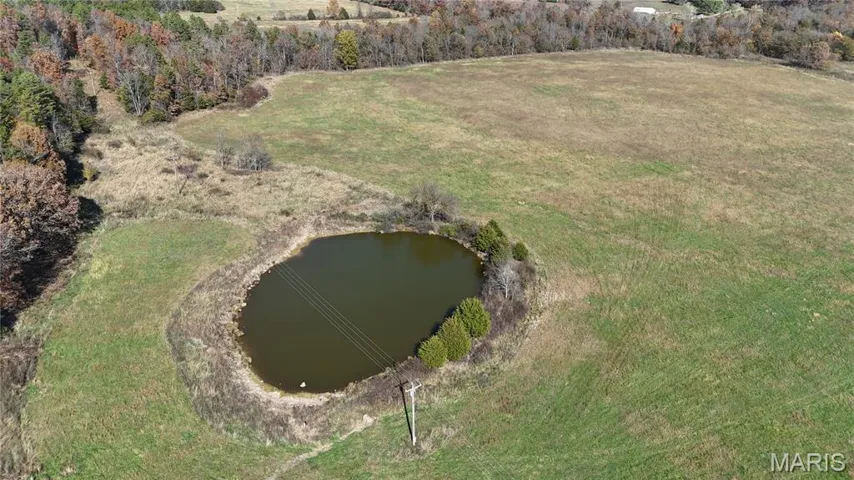 Aerial overview of a stocked pond and pasture