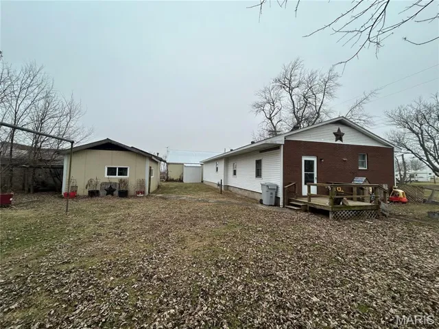 Back of house featuring a deck
