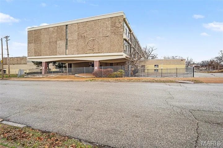 View of property featuring a fenced front yard
