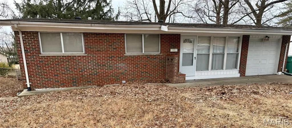 View of front facade featuring brick siding
