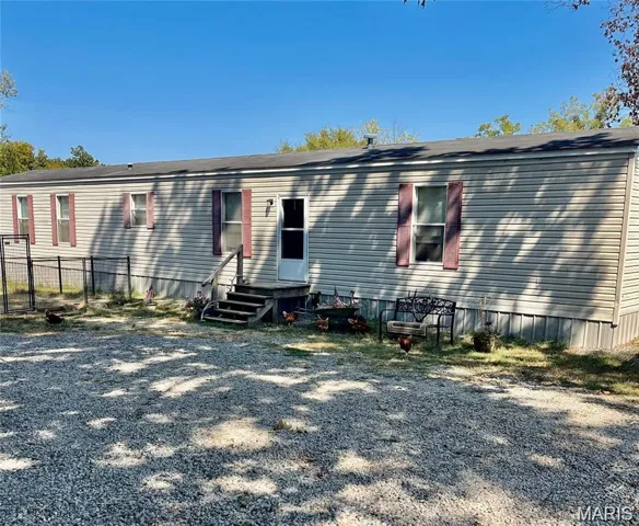 Rear view of property featuring entry steps