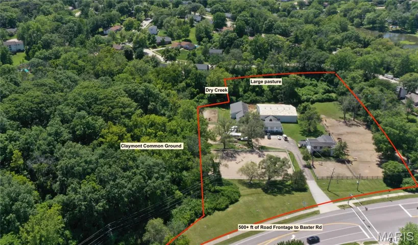 View of property location featuring a heavily wooded area and property parcel outlined