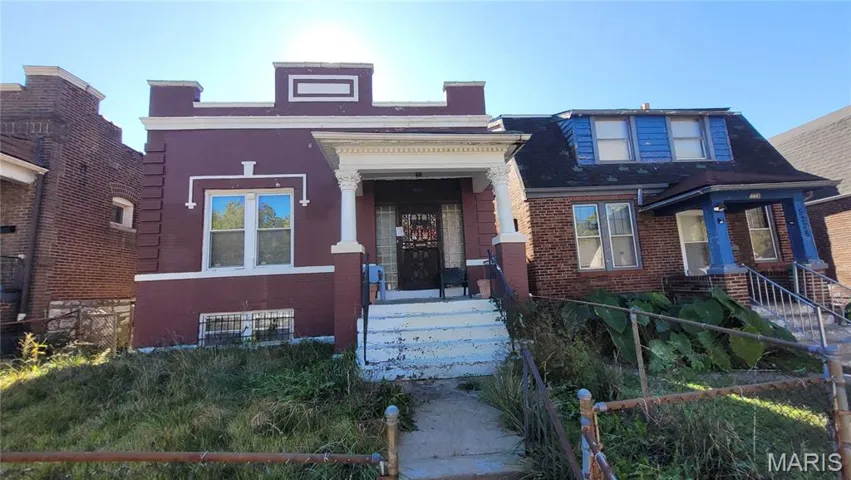 View of front facade featuring brick siding