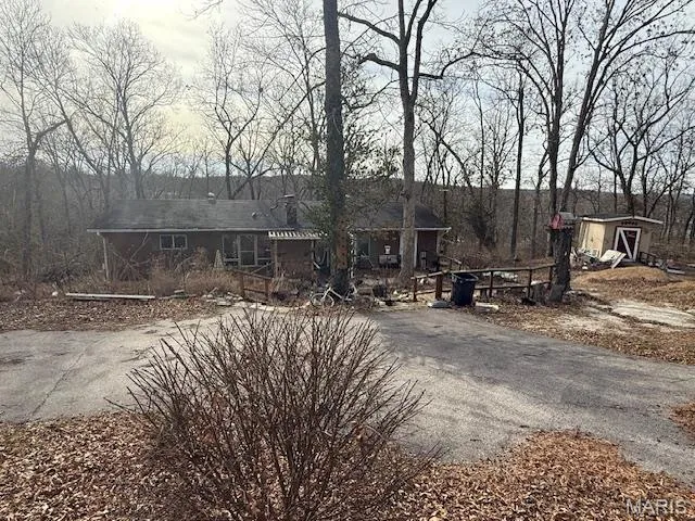 View of front of property featuring driveway