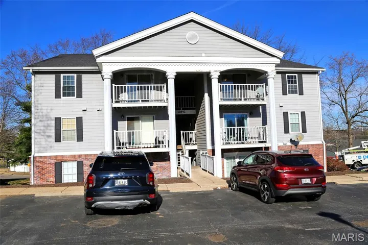 View of front of home featuring brick siding
