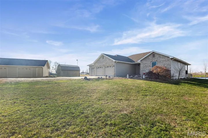View of front of property with a front lawn and brick siding