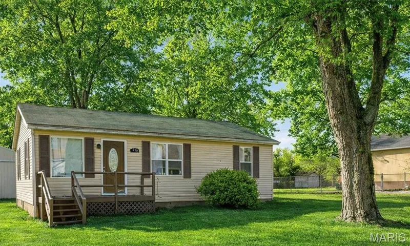 View of front of property featuring crawl space and a wooden deck