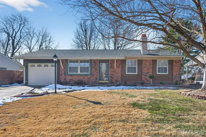 Front Elevation with Brick and Cedar Siding and One Car Garage