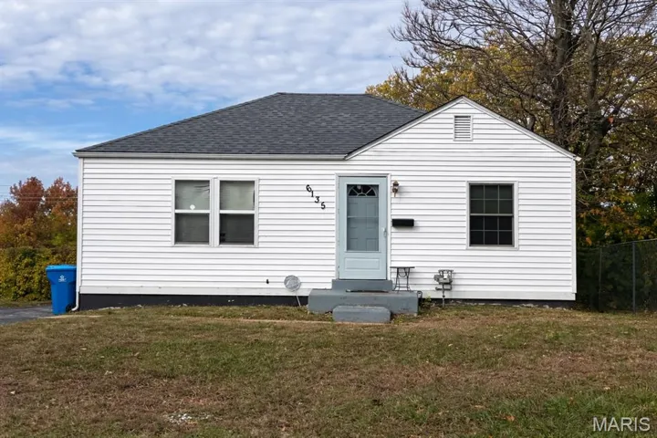Bungalow-style home featuring a shingled roof