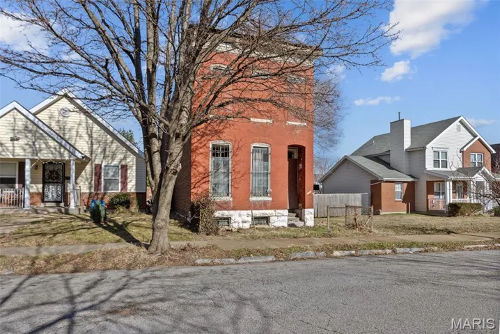 View of front of property featuring brick siding