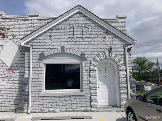 View of front of property with brick siding