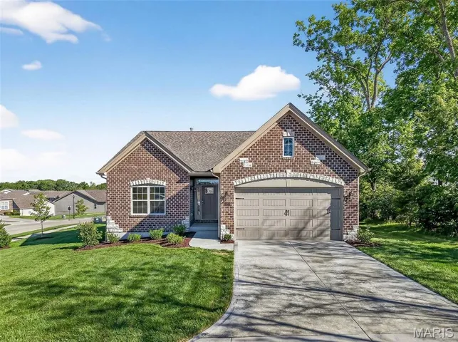 Move In Ready, Low Maintenance Luxury Living! New Construction Home/Villa with Brick Facade, Stone Accents and a Carriage Style Garage Door
