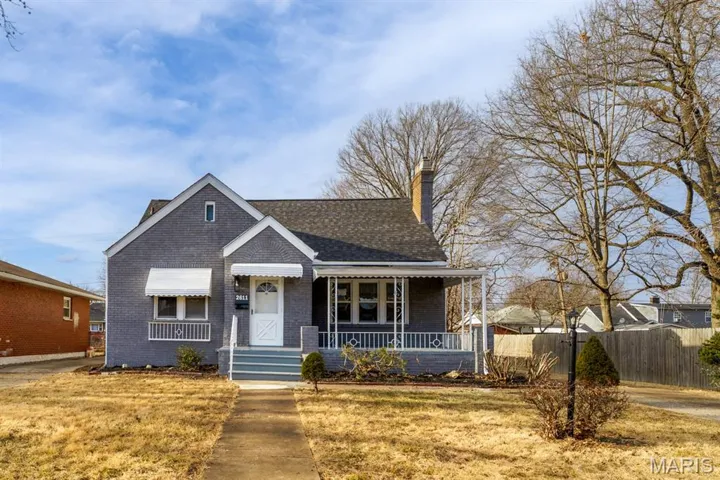 Bungalow-style home with a porch, and  brick siding