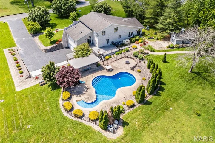 View of subject property with a pool area