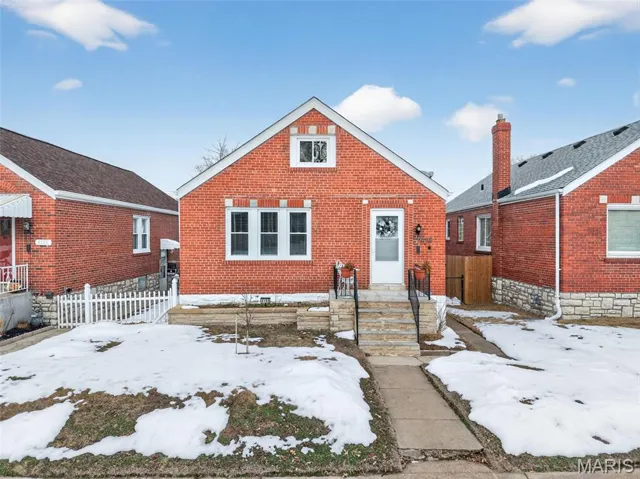 Bungalow-style house featuring brick siding
