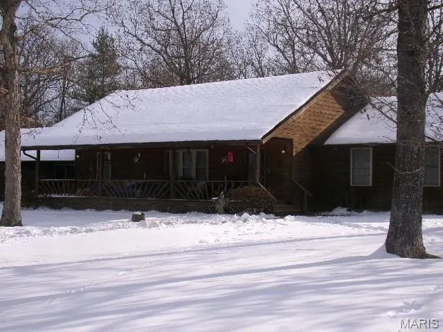 View of front of property featuring covered porch