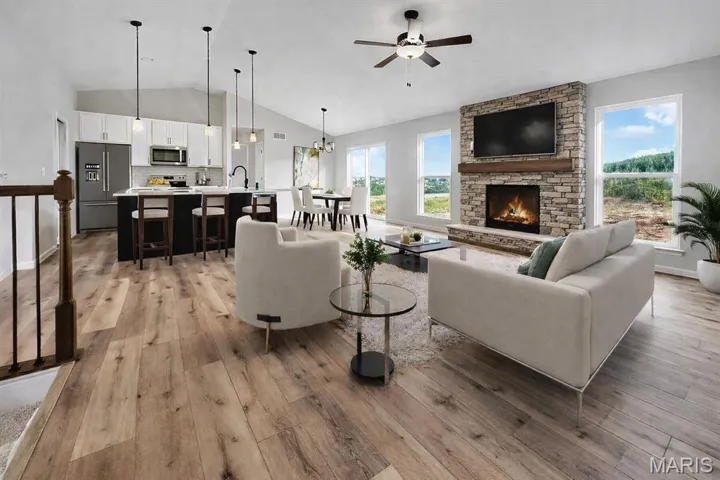 Open floor plan. Fireplace. Vaulted Ceilings. Upgraded flooring. Quartz Countertops.  Island kitchen.