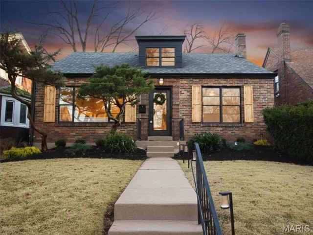 Cozy Brick Bungalow-style house featuring a front yard, serene landscape, and new asphalt driveway. Just 2 houses away from the Park!