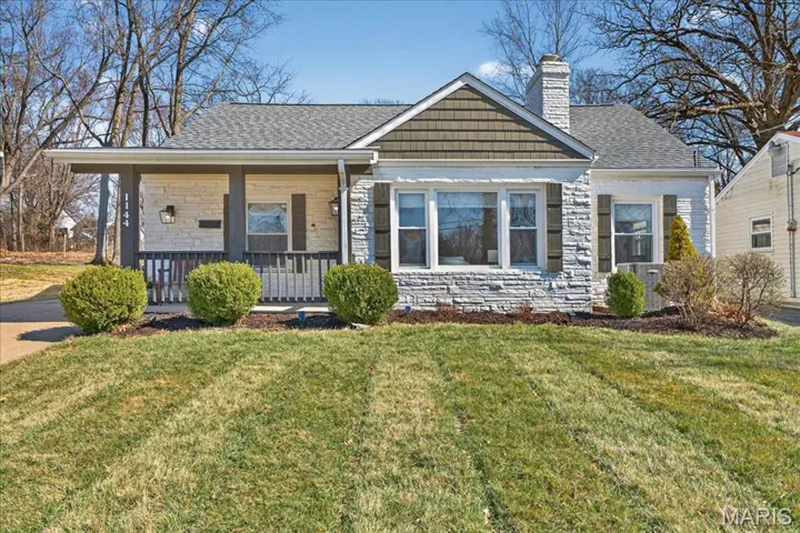 1 1/2 story Kirkwood bungalow on a beautiful lot.