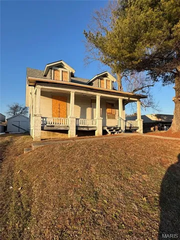 View of front of house featuring covered porch