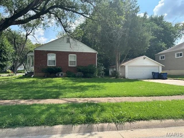 Side of property with garage