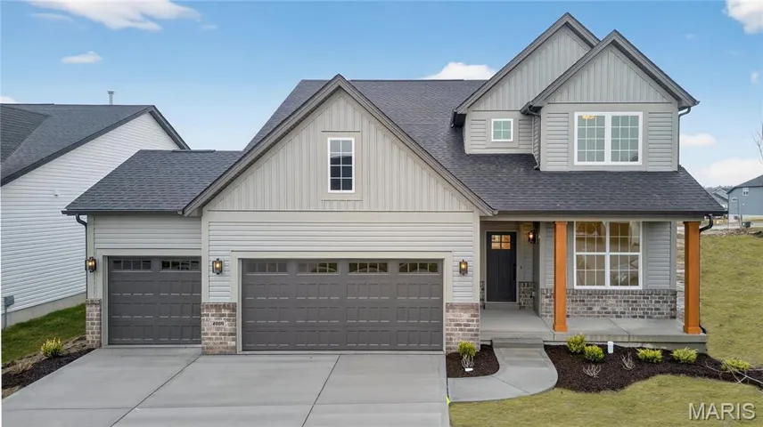 View of front of house featuring board and batten siding, roof with shingles, a porch, and concrete driveway