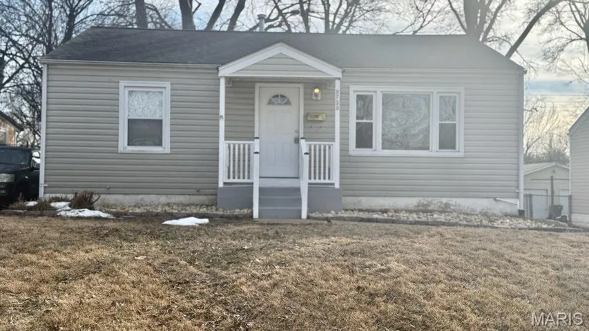 View of front of home featuring a front lawn