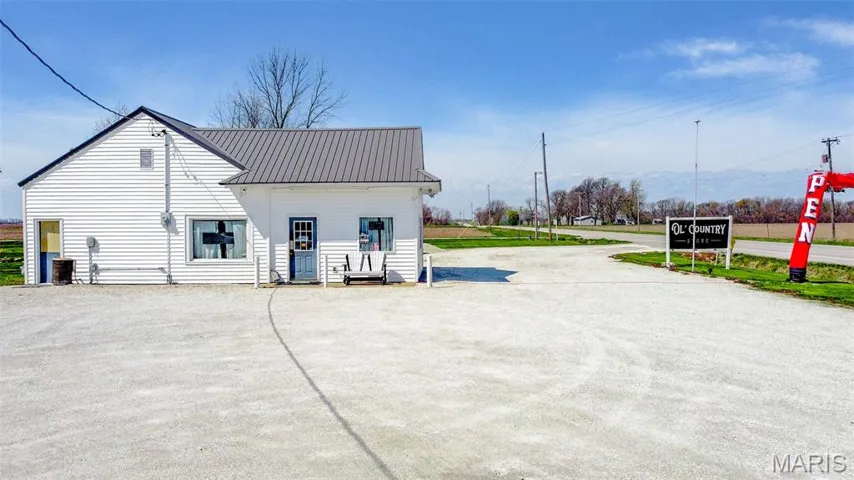 Rear view of property featuring a metal roof