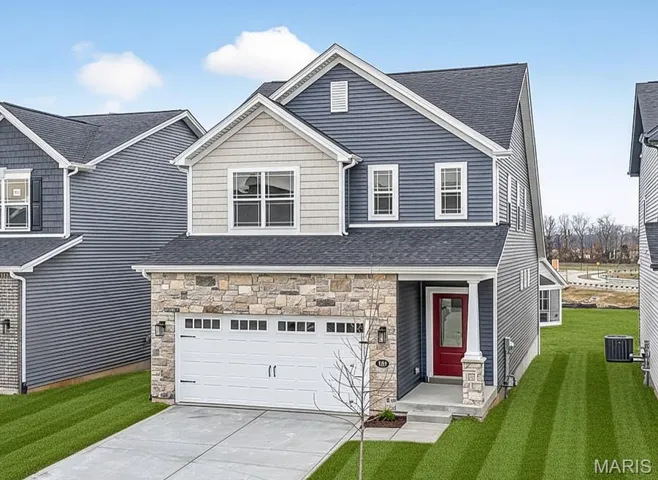 Move in Ready!  New Construction 1.5 Story with Main Floor Primary Suite, Stone and Carriage Style Garage Door