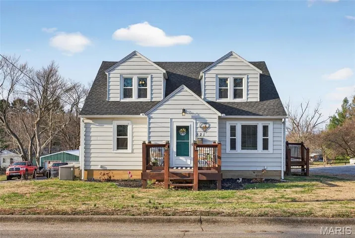 Adorable Cape Cod-Style one and one-half story home with LOTS of space inside and out!!