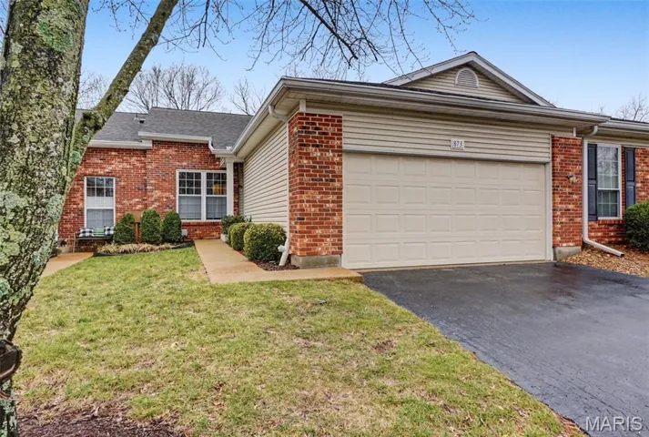 Ranch-Style Condo featuring 2 car attached garage and brick