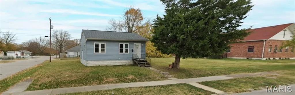 View of front of house with a front yard