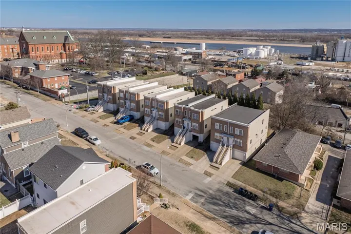 Aerial view of residential area with a large body of water