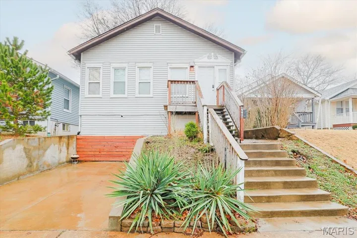 View of front of house with stairs