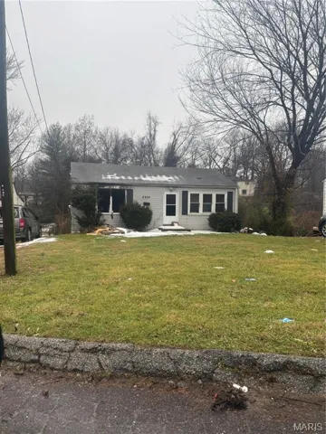 View of front of house with a front lawn