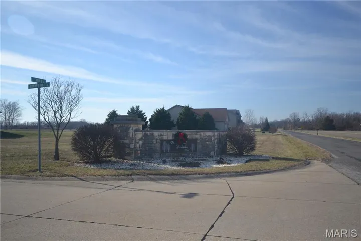 View of concrete road with curbs