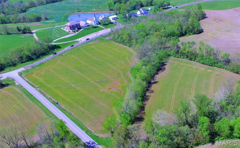 Looking SW towards Hwy 94 across the two fields.  Hwy T in the left of photo. Hwy 94 at top left.  Photo previously taken by Listing Agent.