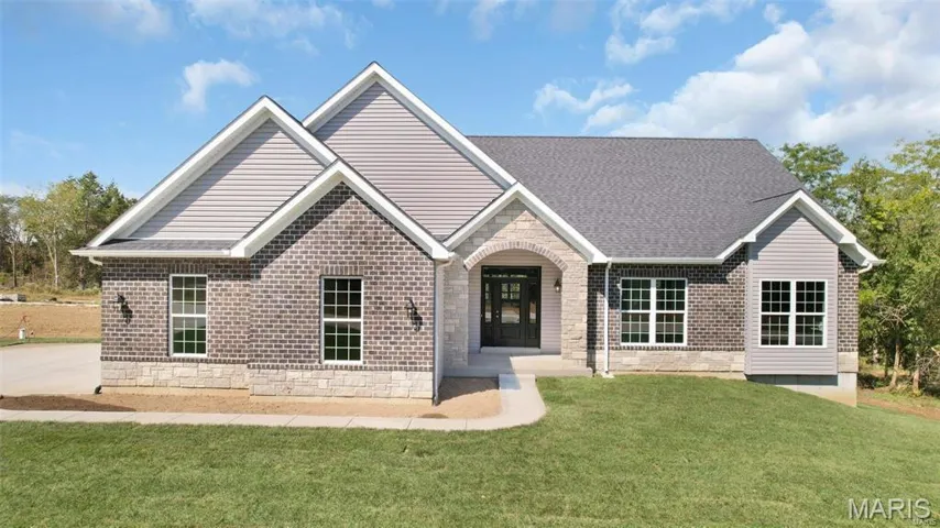 The Sycamore at the Estates at Schaper Farms. Optional elevation upgrade shown in photo of previously built home.